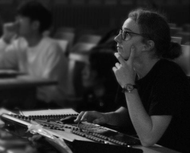 Charlie Newman at a lighting console during a technical rehearsal